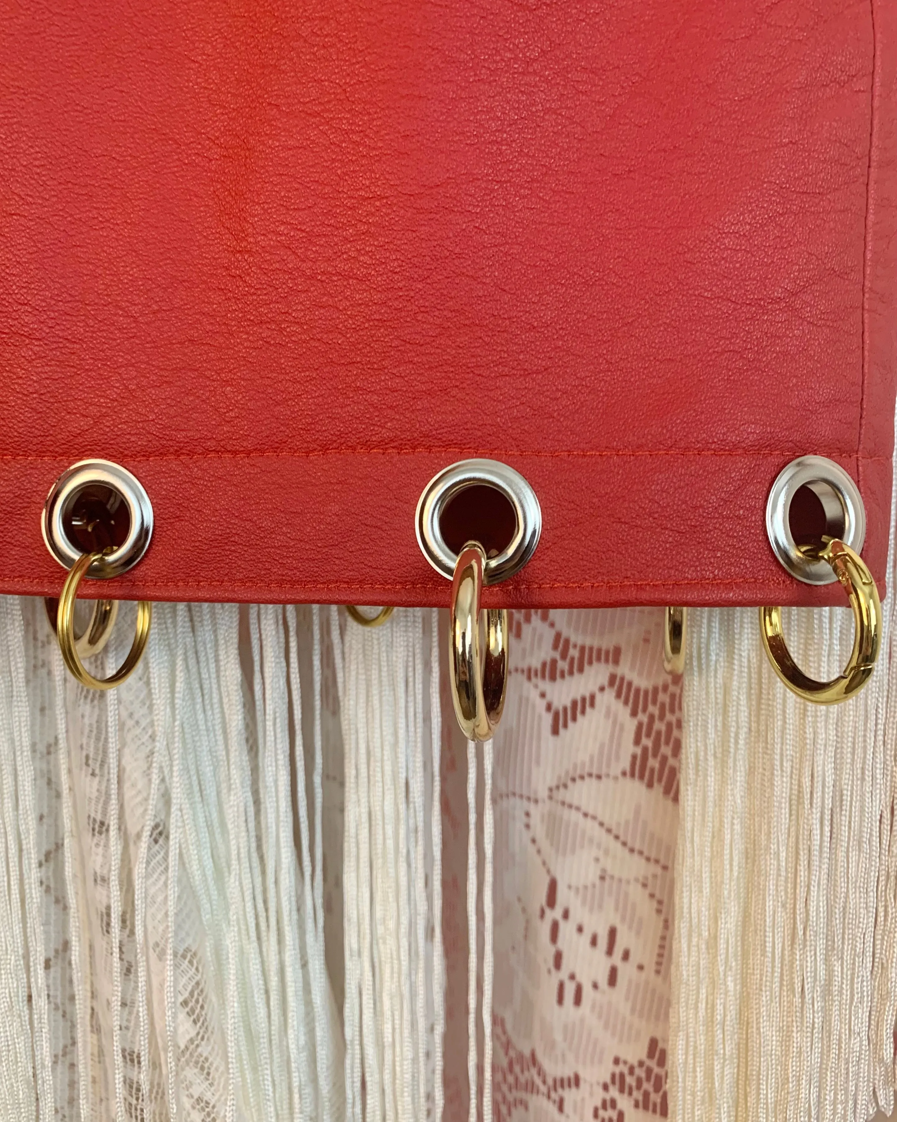 Upcycled grommet ring leather skirt sample